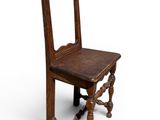 an old wooden chair with a mirror on the back of it
