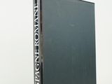 a black book sitting on top of a white table