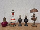 five different lamps sitting on a table next to each other