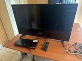a desk with a laptop, monitor, keyboard and mouse on it