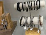 many bracelets on display in a display case