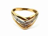 a close up of a gold and diamond ring on a white background