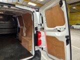 a white van that is parked inside of a building