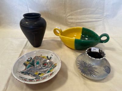 three vases and a bowl on a table
