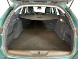 the back of a car with its trunk open showing the cargo area