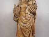 a statue of a woman holding a baby in her arms
