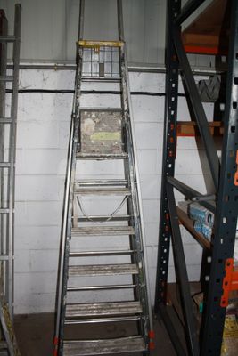 two ladders that are next to each other in a room