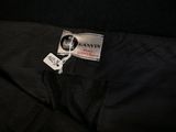 a close up of a black suit with a label on it