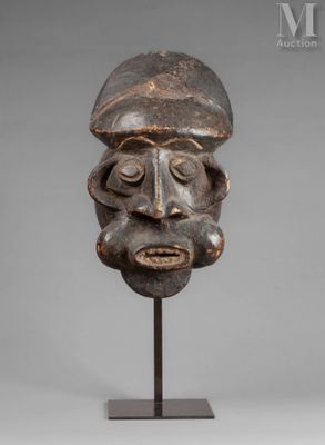 a wooden head of a man with a beard on a stand