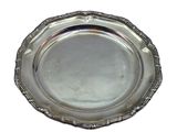 an antique silver plate on a white background with a white background
