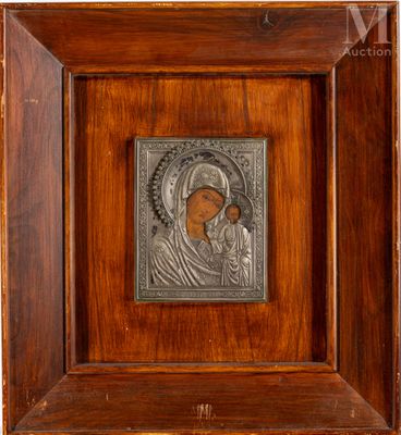 an old wooden frame with a picture of a woman and child