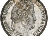 gros plan d'une pièce de monnaie sur laquelle figure une tête de femme