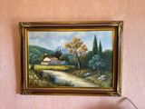 a painting hanging on the wall of a room