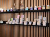 many different types of soaps displayed on the shelves