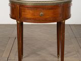 an image of a small round table with a marble top
