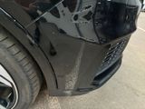 a close up of a car ' s front bumper and fender