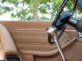 a car dashboard with a steering wheel and a dash board