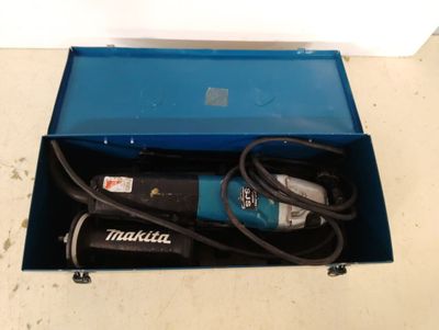 a blue box with a drill and a cord in it