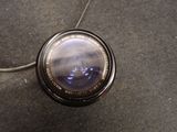 a camera lens that is sitting on the ground