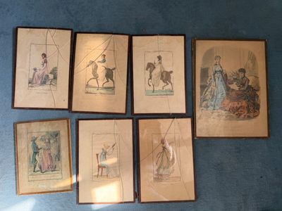 six framed antique prints of people and animals on a blue carpet