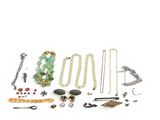 an image of a collection of various jewelry on a white surface