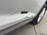 a close up of a car door with a sticker on it