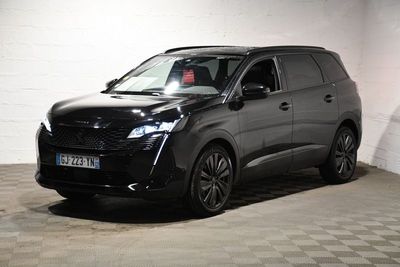 a picture of a black car parked in a garage