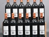 six bottles of wine are lined up in a row on a table
