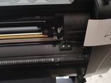an image of a machine that is being used to cut fabric