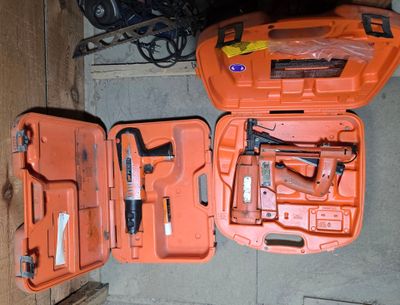 an orange tool case with tools in it sitting on the floor