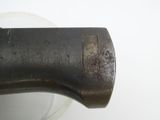 a close up of a metal object on a white surface