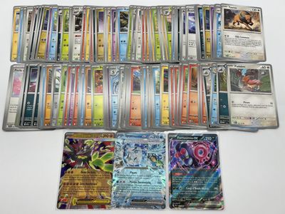 a lot of different pokemon cards on the table