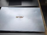 two laptops that are sitting on a table