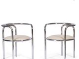 pair of chrome steel and leather armchairs