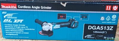 packaging of a cordless angle grinder sitting on the ground