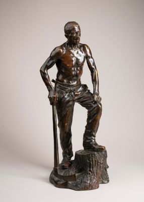 statue of a man standing on a stump with a stick