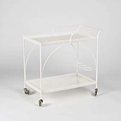 an image of a white metal serving cart on wheels