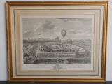 an old picture of a hot air balloon flying over a city