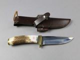 two knives that are sitting next to each other on a table