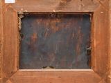 an old wooden picture frame with a rusted surface and a hole in the middle