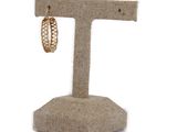 a close up of a pair of earrings on a stand