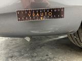 a close up of a sticker on a car ' s rear bumper