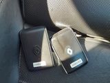 two cell phones that are sitting in the back seat of a car