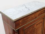 a marble top on a wooden cabinet in a room