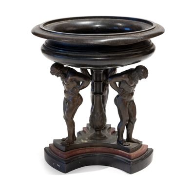 a black bowl with two figures on it