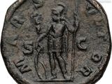 an ancient coin with a man holding a sword and a shield