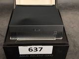 a box with a watch inside of it on a table