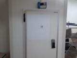a white door with a sign on it in a room