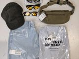 a bag, hat, sunglasses, and other items that are on a table