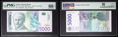 three different types of currency are displayed in a display case